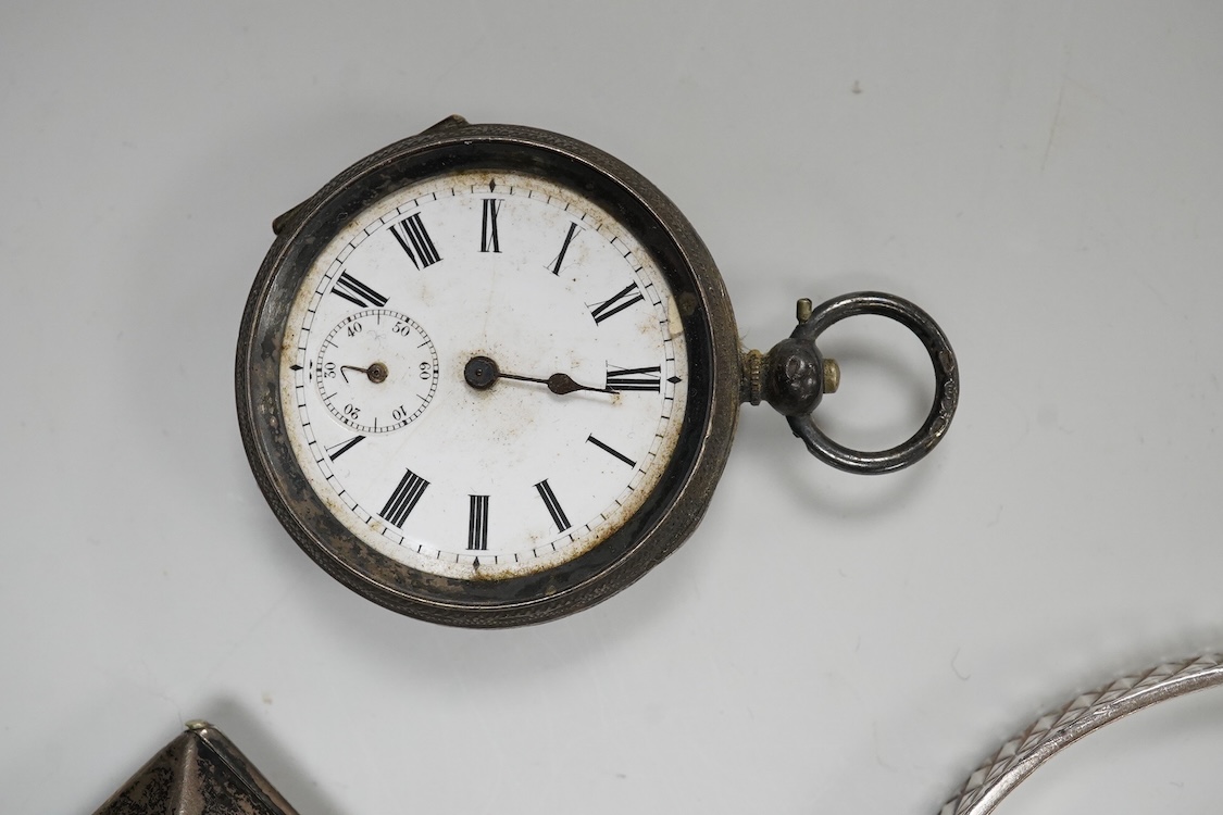A collection of small silver to include a cigarette case, two napkin rings, three pairs of sugar tongs, a thimble, a lady's wrist watch and a mounted glass toilet jar. together with a 925 fob watch, a 935 mounted lighter